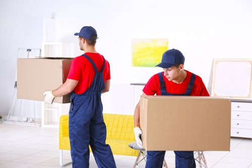 Removal van and moving boxes in Belsize Park residential street