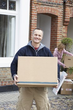 Movers handling furniture through a Belsize Park-style period property interior