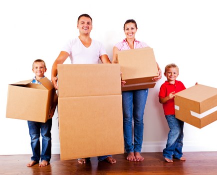 A professional removals crew assisting with a home or office move in north west London
