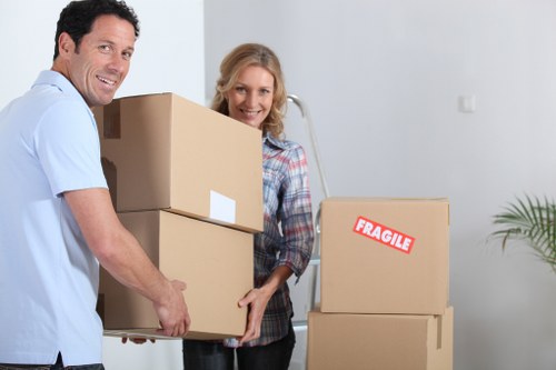 Professional packers organising boxes in a Belsize Park property